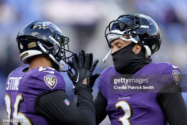 Geno Stone and Odell Beckham Jr. #3 of the Baltimore Ravens high-five prior to the AFC Divisional Playoff game against the Houston Texans at M&T Bank...