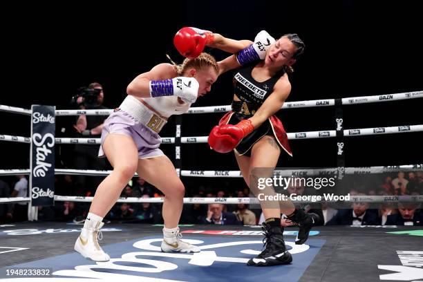 Elle Brooke and Andrea Jane Bunker exchange punches during the Misfits Boxing Female Middleweight title fight between Andrea Jane Bunker and Elle...