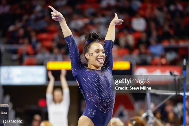 Gabby McLaughlin of the Auburn Tigers salutes after competing on the balance beam at Neville Arena on January 19, 2024 in Auburn, Alabama.