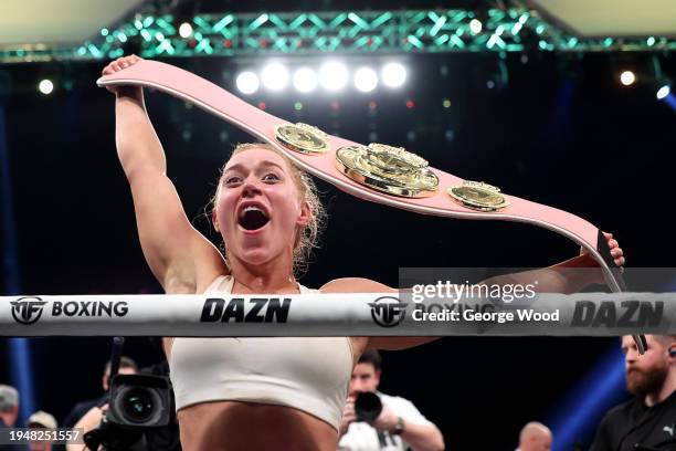 Elle Brooke celebrates with her belt after victory in the Misfits Boxing Female Middleweight title fight between Andrea Jane Bunker and Elle Brooke...