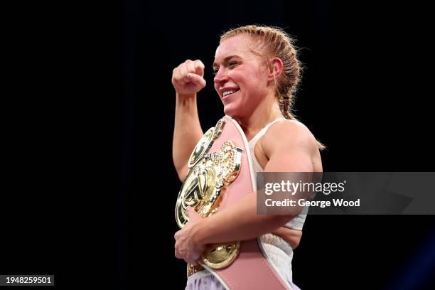 Elle Brooke celebrates with her belt after victory in the Misfits Boxing Female Middleweight title fight between Andrea Jane Bunker and Elle Brooke...