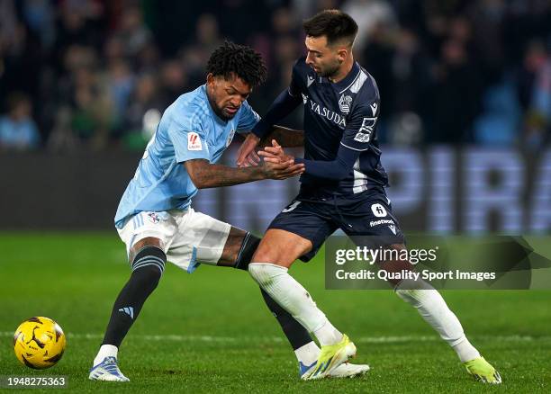 Jailson Marques Siqueira of RC Celta de Vigo competes for the ball with Brais Mendez of Real Sociedad during the LaLiga EA Sports match between RC...