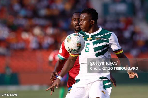 Cameroon's defender Nouhou Tolo fights for the ball with Gambia's midfielder Ablie Jallow during the Africa Cup of Nations 2024 group C football...