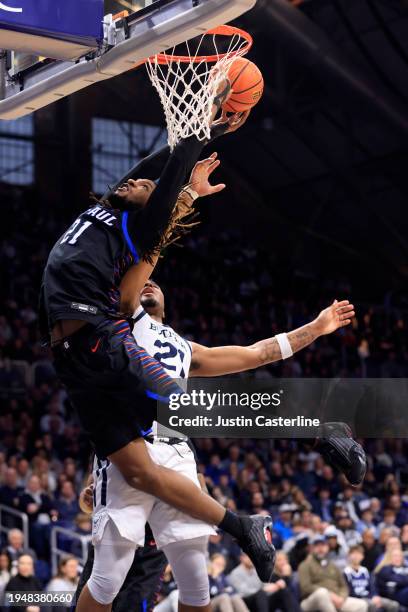 Da'Sean Nelson of the DePaul Blue Demons takes a shot over Pierre Brooks of the Butler Bulldogs during the second half at Hinkle Fieldhouse on...