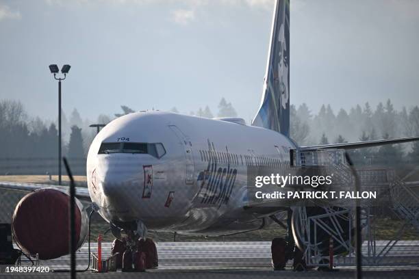 Alaska Airlines N704AL, a 737 Max 9, which made an emergency landing at Portland International Airport on January 5 is parked on the tarmac in...