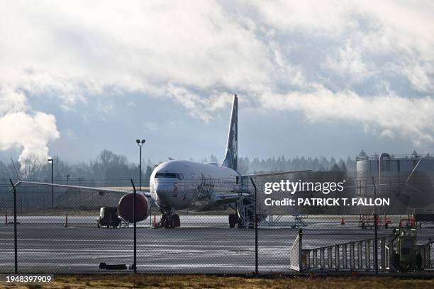 Alaska Airlines N704AL, a 737 Max 9, which made an emergency landing at Portland International Airport on January 5 is parked on the tarmac in...