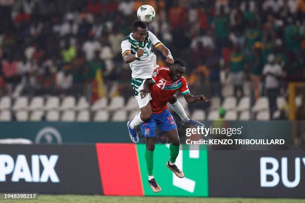 Cameroon's defender Nouhou Tolo fights for the ball with Gambia's defender Muhammed Sanneh during the Africa Cup of Nations 2024 group C football...