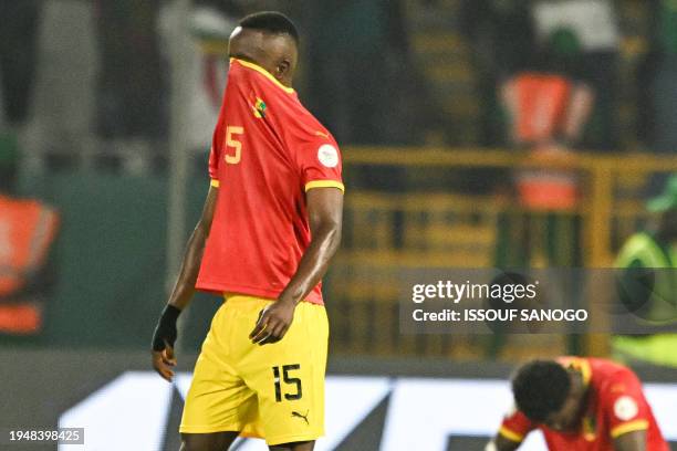 Guinea's midfielder Seydouba Cisse reacts after losing at the end of the Africa Cup of Nations 2024 group C football match between Guinea and Senegal...