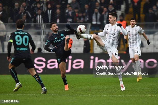 Ege Tiknaz of Besiktas and Emre Akbaba of Adana Demirspor battle for the ball during the Turkish Super League match between Besiktas and Adana...