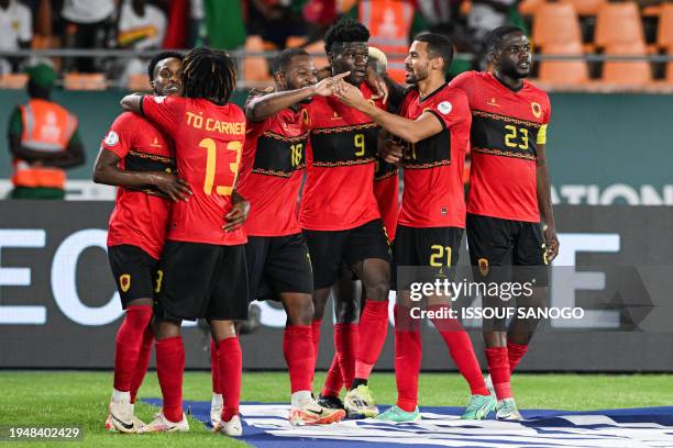 Angola's forward Zini celebrates with teammates after scoring his team's second goal during the Africa Cup of Nations 2024 group D football match...