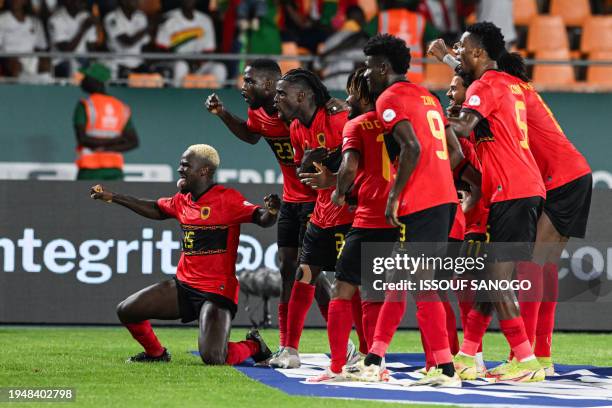 Angola's forward Zini celebrates with teammates after scoring his team's second goal during the Africa Cup of Nations 2024 group D football match...