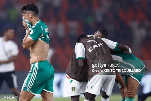Algeria's forward Baghdad Bounedjah reacts after Mauritania won the Africa Cup of Nations 2024 group D football match between Mauritania and Algeria...