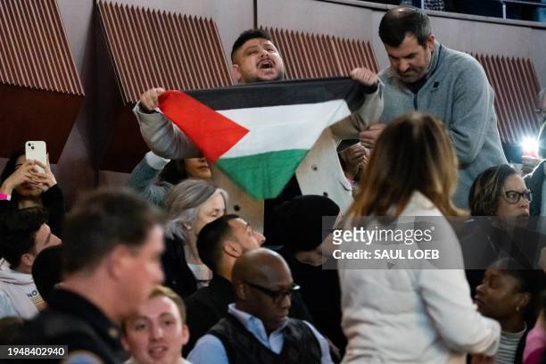Pro-Palestinian protestor shouts in support of Gaza as US President Joe Biden speaks during a campaign rally to Restore Roe at Hylton Performing Arts...