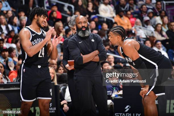 Cam Thomas talks to Dennis Smith Jr. #4 and Head Coach Jacque Vaughn of the Brooklyn Nets during the game against the LA Clippers on January 21, 2024...