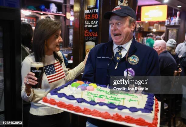 James Cromer presents Republican presidential candidate former U.N. Ambassador Nikki Haley with a birthday cake as she visits The Peddler's Daughter...