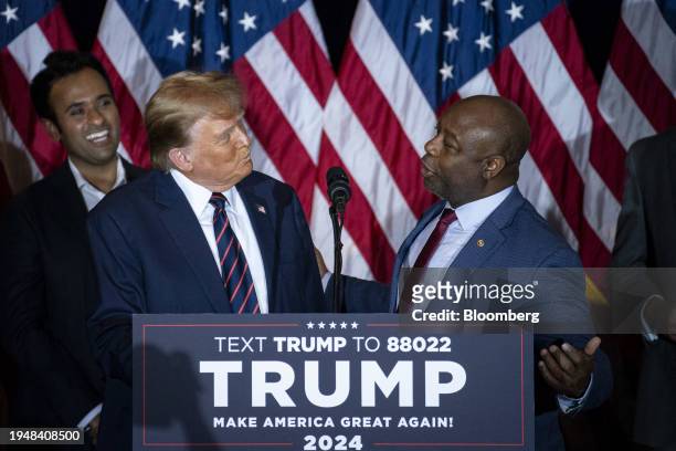 Senator Tim Scott, a Republican from South Carolina, right, and former US President Donald Trump during a New Hampshire primary election night watch...