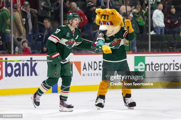 Minnesota Wild left wing Marcus Foligno is congratulated by mascot Nordy after an NHL game between the Washington Capitals and Minnesota Wild on...