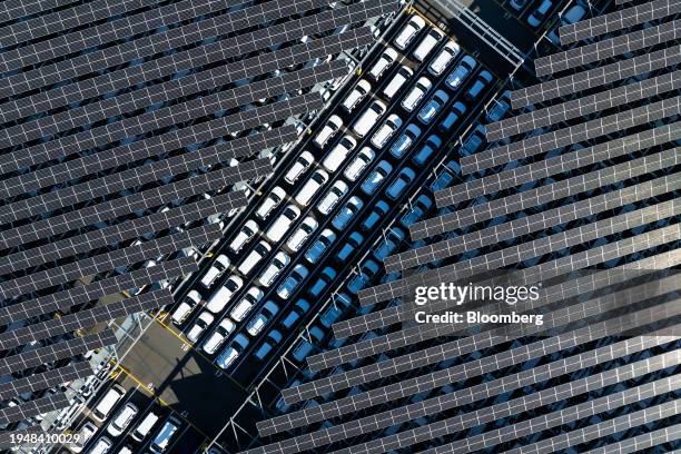 Hyundai Motor Co. Vehicles bound for shipment parked under solar panels at a parking lot of the company's Ulsan plant in Ulsan, South Korea, on...