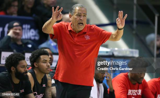 Head coach Kelvin Sampson of the Houston Cougars calls in a play during the second half against the Brigham Young Cougars at the Marriott Center on...