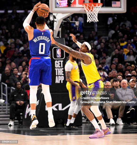 Los Angeles, CA Russell Westbrook of the LA Clippers shoots a three pointer with one shoe against the Los Angeles Lakers in the first half of a NBA...