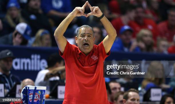 Head coach Kelvin Sampson of the Houston Cougars calls in a play during the first half against the Brigham Young Cougars at the Marriott Center on...