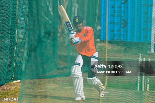 India's Shubman Gill bats at the nets during a practice session at the Rajiv Gandhi International Cricket Stadium in Hyderabad on January 24 on the...