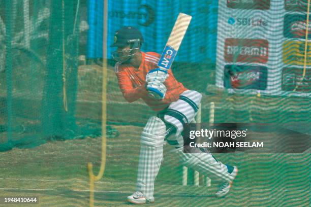 India's Shubman Gill bats at the nets during a practice session at the Rajiv Gandhi International Cricket Stadium in Hyderabad on January 24 on the...