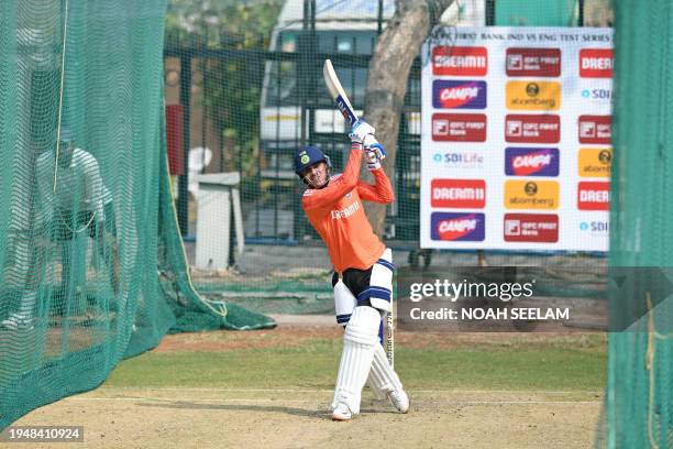 India's Shubman Gill bats at the nets during a practice session at the Rajiv Gandhi International Cricket Stadium in Hyderabad on January 24 on the...