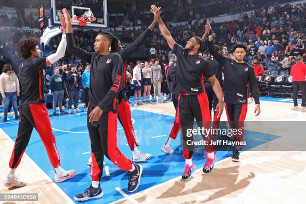 The Portland Trail Blazers high five before the game against the Oklahoma City Thunder on January 23, 2024 at Paycom Arena in Oklahoma City,...