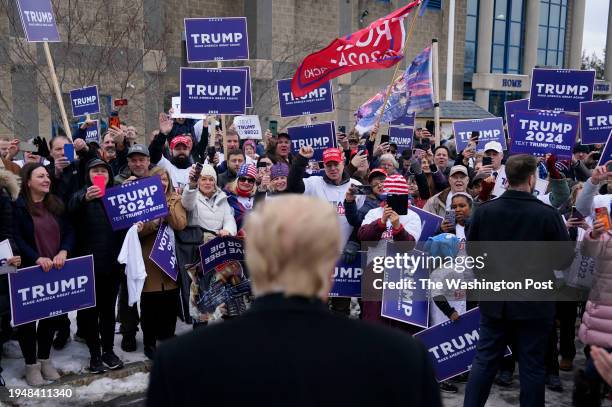 January 23: Former president Donald Trump greets supporters outside a polling location on Tuesday, January 23, 2024 at a high school in Londonderry,...