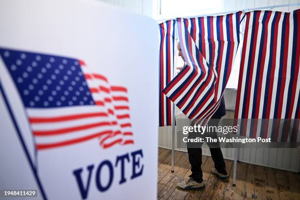 Voter prepares to leave a voting booth as they take part in the New Hampshire primary at Sanbornton Old Town Hall on Tuesday January 23, 2024 in...