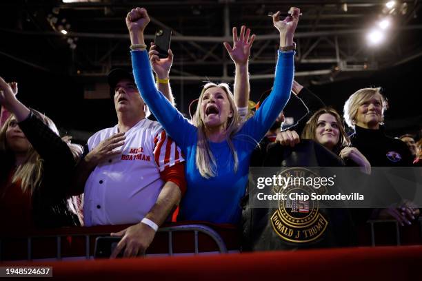 Supporters cheer for Republican presidential candidate and former President Donald Trump during a campaign rally at the SNHU Arena on January 20,...