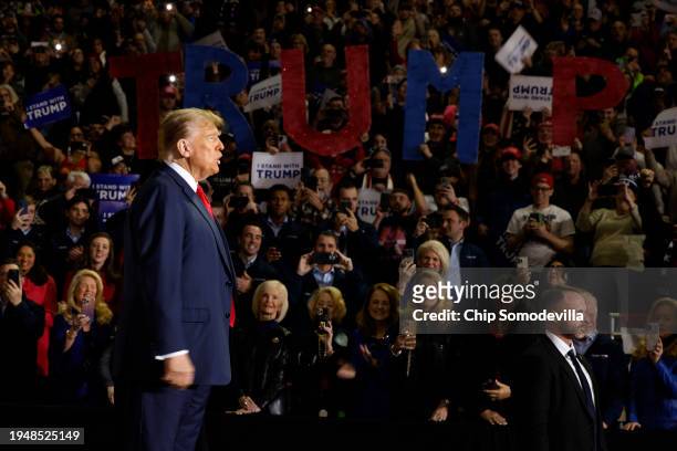 Republican presidential candidate and former President Donald Trump takes the stage during a campaign rally at the SNHU Arena on January 20, 2024 in...