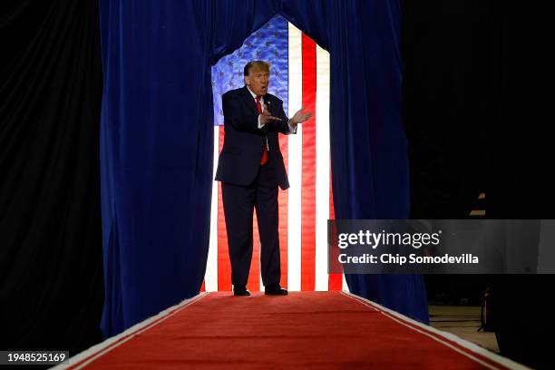 Republican presidential candidate and former President Donald Trump takes the stage during a campaign rally at the SNHU Arena on January 20, 2024 in...