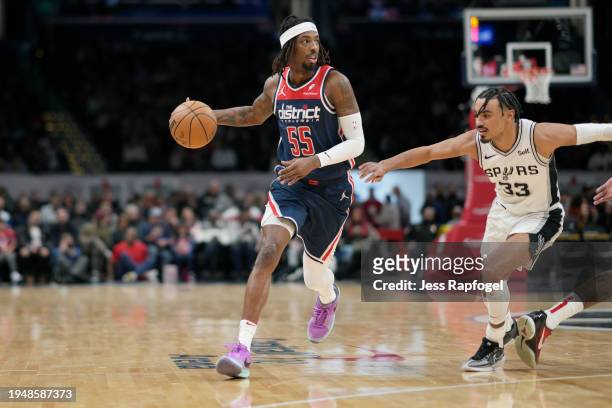 Delon Wright of the Washington Wizards dribbles to the hoop against Tre Jones of the San Antonio Spurs during the first half at Capital One Arena on...