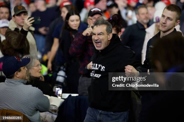 Protester is ejected by police from a campaign rally with Republican presidential candidate and former President Donald Trump at the SNHU Arena on...