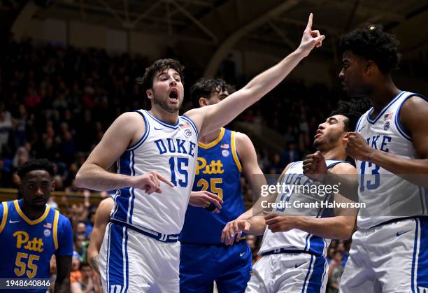 Ryan Young of the Duke Blue Devils signals for possession after making a blok against the Pittsburgh Panthers during the first half of the game at...