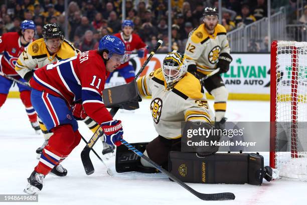Brendan Gallagher of the Montreal Canadiens takes a shot on goal to score against Linus Ullmark of the Boston Bruins during the second period at TD...