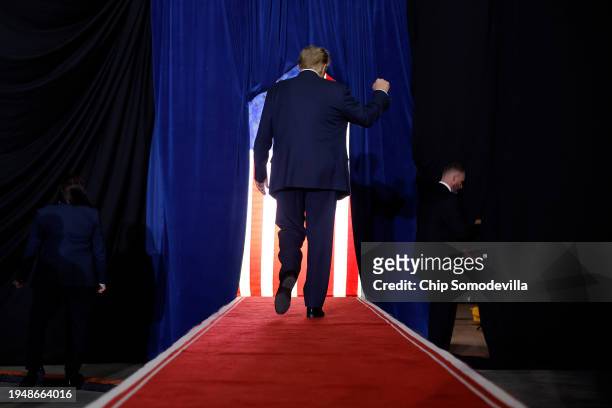 Republican presidential candidate and former President Donald Trump walks off the stage at the conclusion of a campaign rally at the SNHU Arena on...