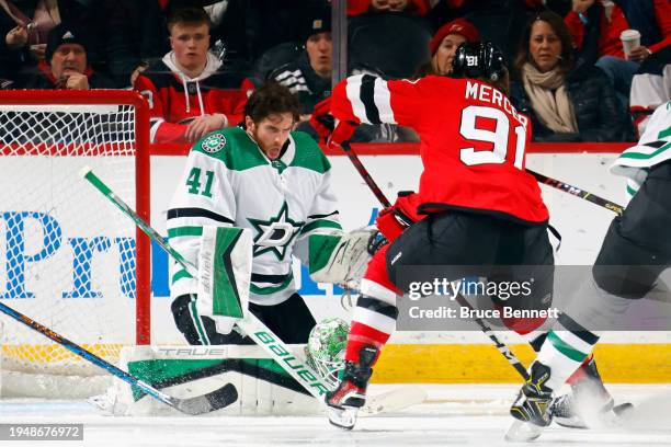 Scott Wedgewood of the Dallas Stars loses his mask during the second period against the New Jersey Devils at Prudential Center on January 20, 2024 in...