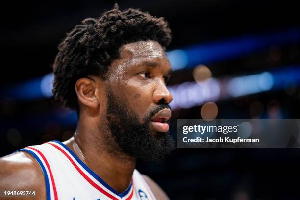 Joel Embiid of the Philadelphia 76ers walks off the court after defeating the Charlotte Hornets during their game at Spectrum Center on January 20,...