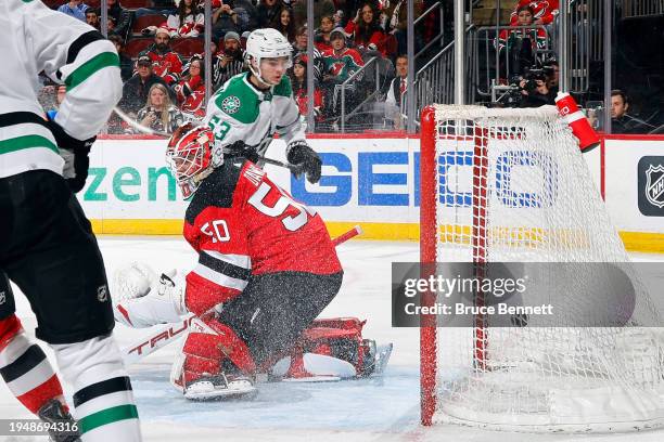 Wyatt Johnston of the Dallas Stars scores a third period goal against Nico Daws of the New Jersey Devils at Prudential Center on January 20, 2024 in...