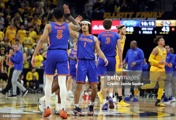 Walter Clayton Jr. #1 and Will Richard of the Florida Gators high-five during a timeout in the 2nd half of the game at T-Mobile Center on January 20,...
