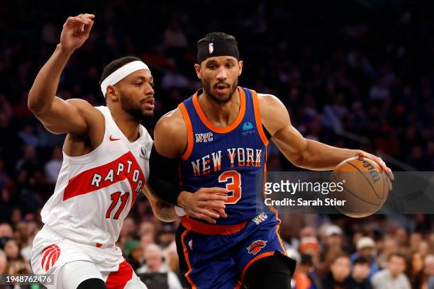 Josh Hart of the New York Knicks dribbles against Bruce Brown of the Toronto Raptors during the first half at Madison Square Garden on January 20,...