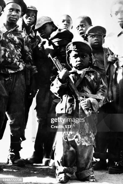 Armed children of the MPLA parade in Luanda on February 16, 1976. After independence, Angola was the scene of an intense civil war from 1975 to 2002,...