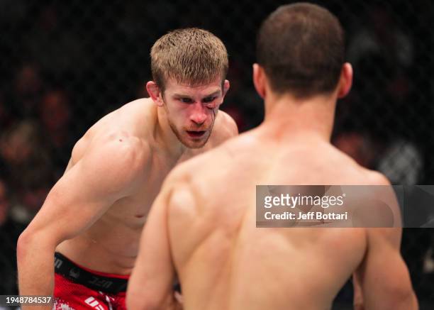 Arnold Allen of England battles Movsar Evloev of Russia in a featherweight bout during the UFC 297 event at Scotiabank Arena on January 20, 2024 in...