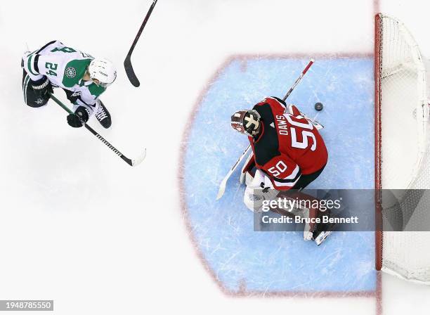 Roope Hintz of the Dallas Stars scores a second period goal against Nico Daws of the New Jersey Devils at Prudential Center on January 20, 2024 in...