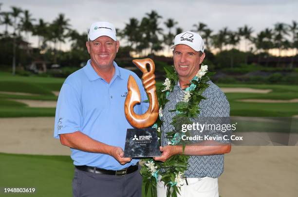 Steven Alker of New Zealand and his caddie Troy Martin pose with the trophy after winning the PGA TOUR Champions Mitsubishi Electric Championship at...