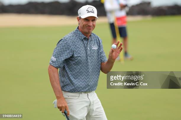 Steven Alker of New Zealand reacts after his birdie putt on the 17th gree during the final round of the Mitsubishi Electric Championship at Hualalai...