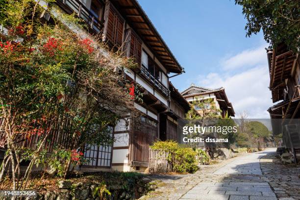 the nakasendo street of stone pavement with wooden houses in gifu japan - 木曽山脈 ストックフォトと画像